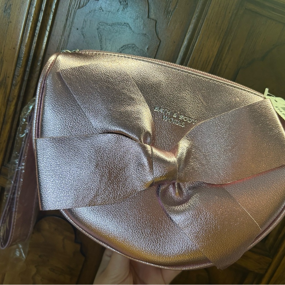 BATH AND BODY WORKS Bow-Accent Metallic Pink Clutch
